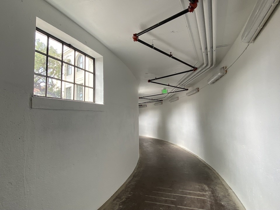 Restored interior, enclosed passageway to Building 205